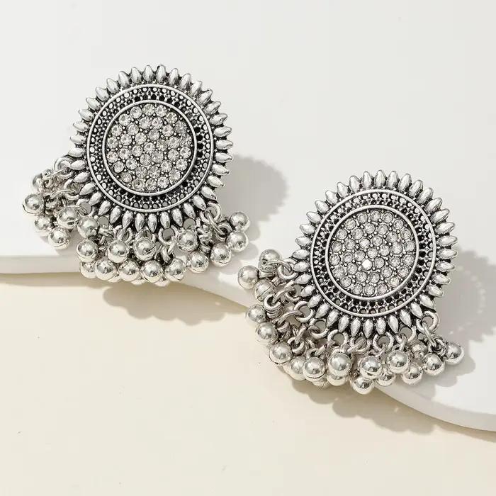 1 paire de boucles d'oreilles bohèmes vintage exagérées, design en métal ajouré complexe pour la mod
