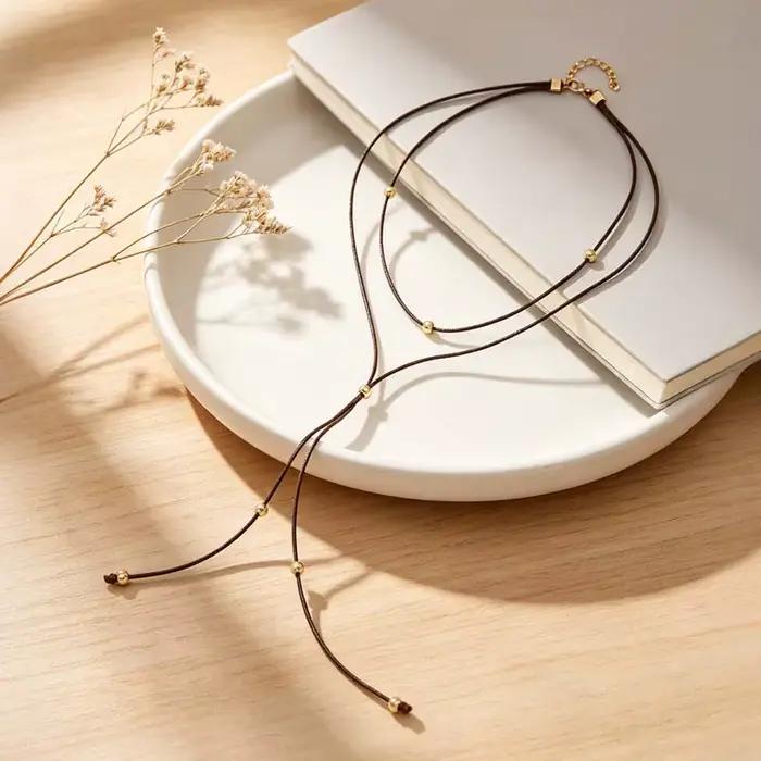 Collier pendentif nœud papillon en corde noire vintage pour femme, élégant, en métal perlé, long et réglable, accessoires de bijoux