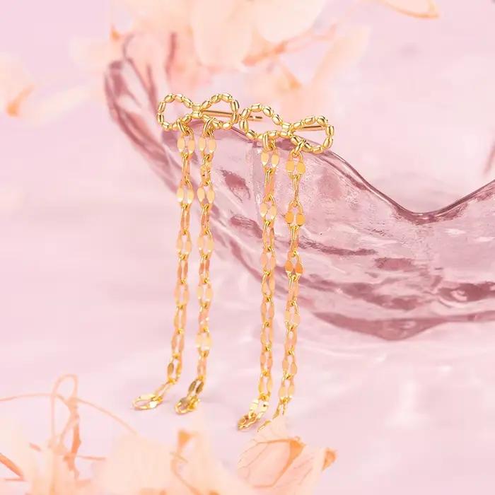Boucles d'oreilles à pompons dorés 2026 – Design minimaliste, bijoux haut de gamme pour femme, style mode soirée, individualité mise en valeur