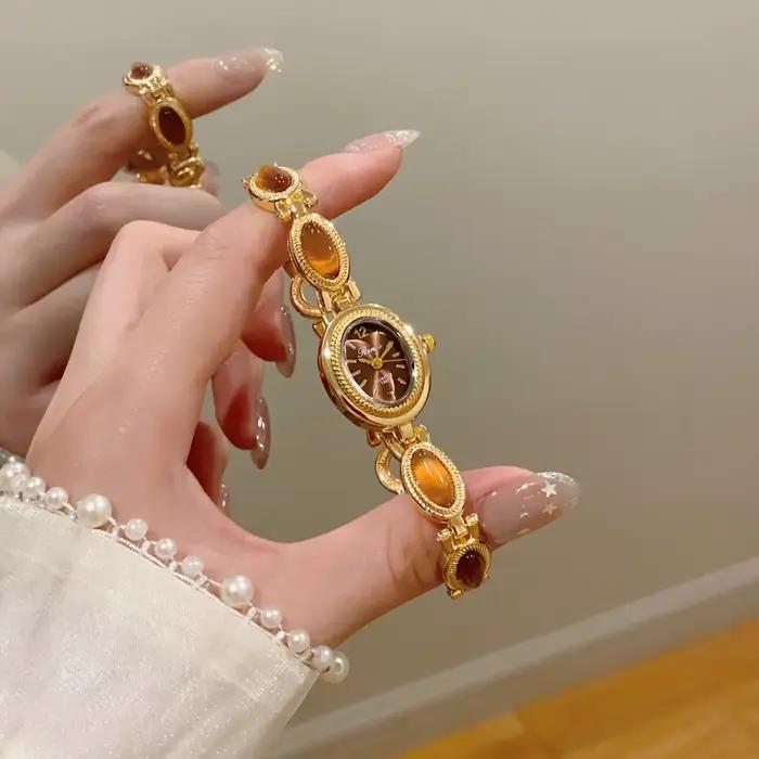 Nouvelle montre-bracelet élégante pour femme avec pierres précieuses colorées, mouvement à quartz, cadran ovale, idéale pour le quotidien et les fêtes, cadeau parfait.