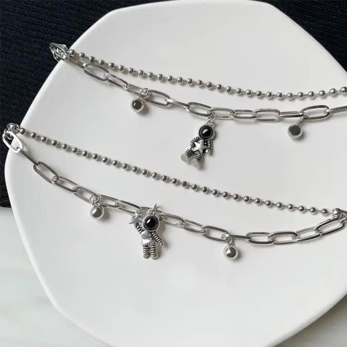 Bracelet de Couple en Alliage de Zinc avec Aimant en Forme de Cœur et Pendentif Astronaute Élégant et Romantique pour Hommes et Femmes Occasions Spéciales