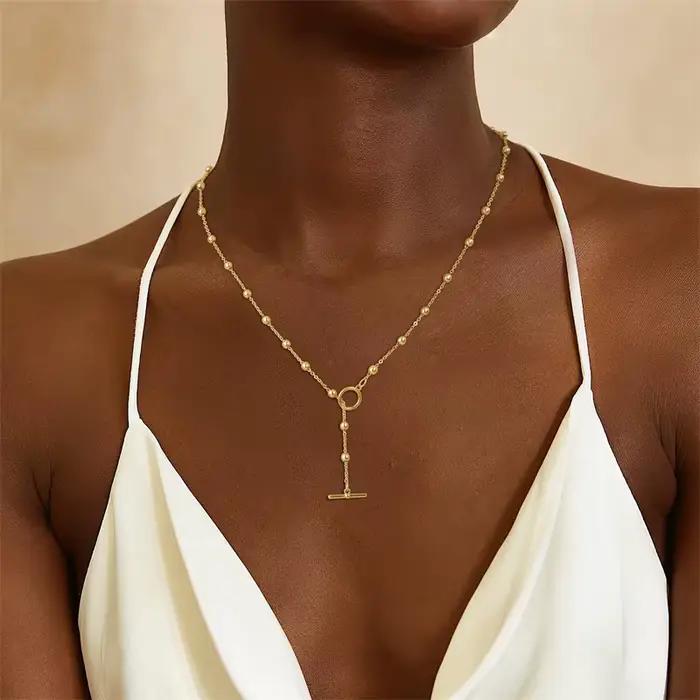 Collier de luxe en forme d'oeil Serpentine pour femmes, couleur dorée, chaîne en forme de Y, pompon empilé, accessoires de bijoux