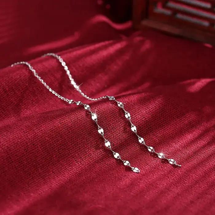 Boucles d'oreilles pendantes torsadées à sequins géométriques couleur argent pour femmes