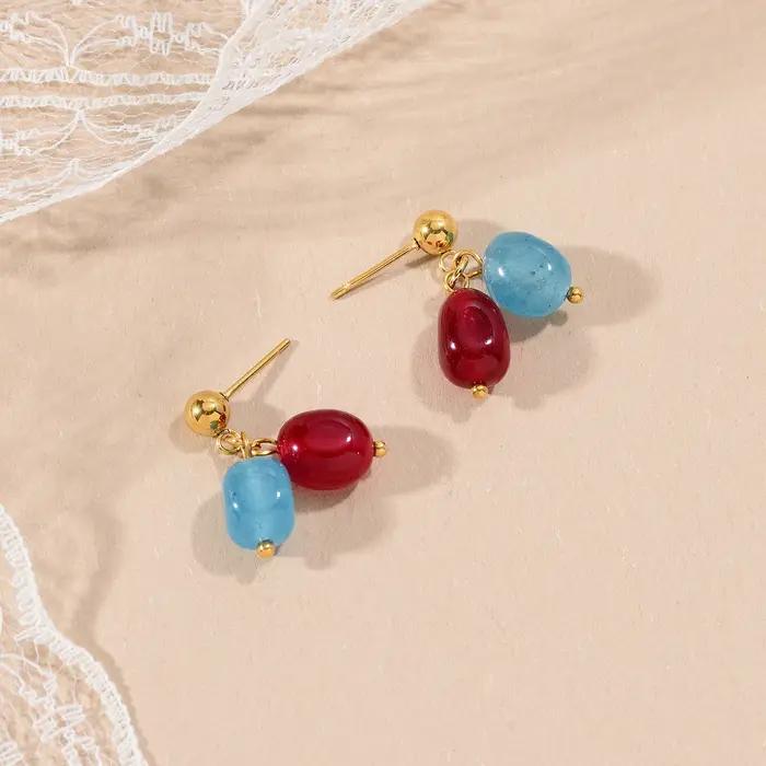 Boucles d'oreilles longues élégantes avec pendentif en pierre colorée