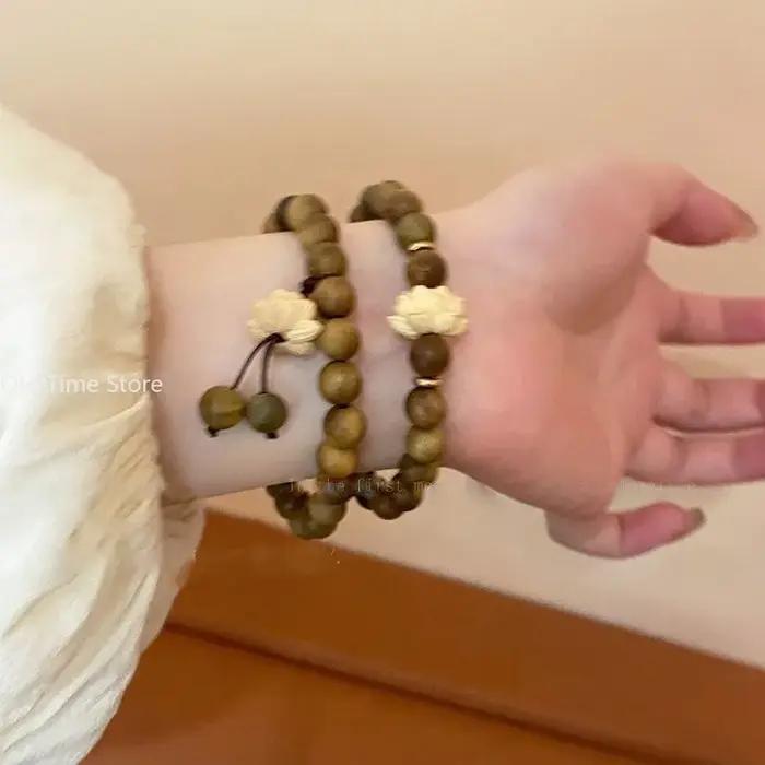 Bracelet de perles en bois réglable avec breloques style mode naturel élégant pour femme et homme en brun rougeâtre ou or jaune