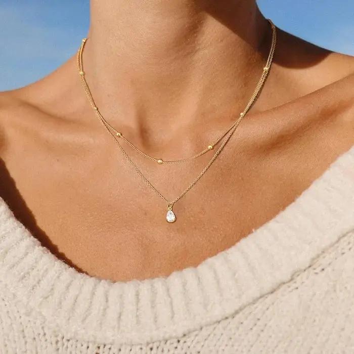 Collier en or à triple couche pour femmes en acier inoxydable forme de goutte d'eau avec zircone cubique pour superposition et belles occasions