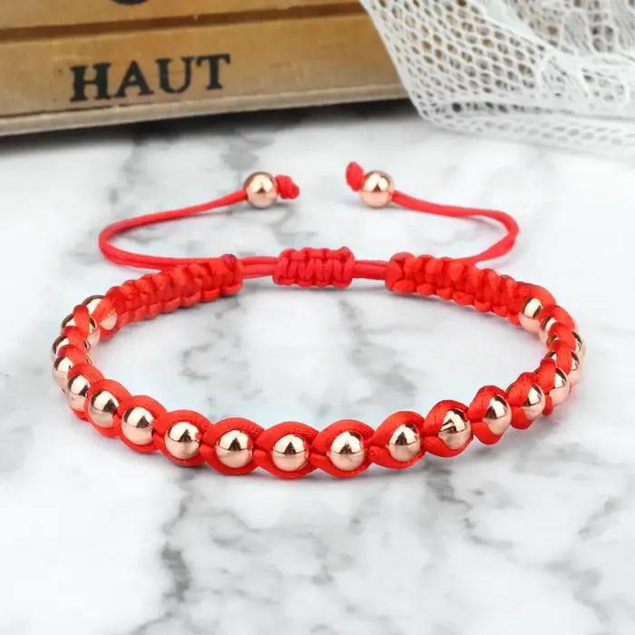 Bracelet Tressé Porte-Bonheur RaeRina en Corde Rouge et Perles en Cuivre Pour Homme et Femme Occasions Spéciales