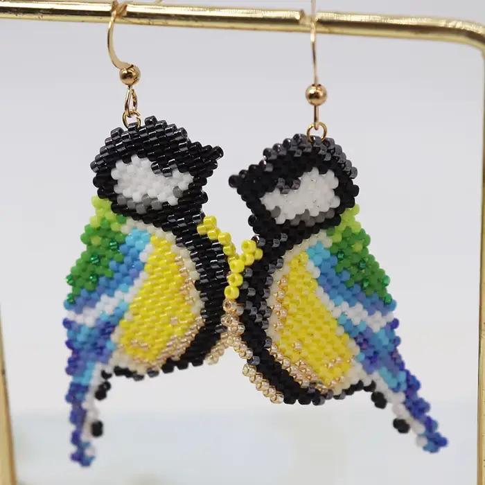 Boucles d'oreilles perlées pour oiseaux de perroquet, boucles d'oreilles en perles de riz, alliage simple, conception originale de Bohême, tricot à la main, marée