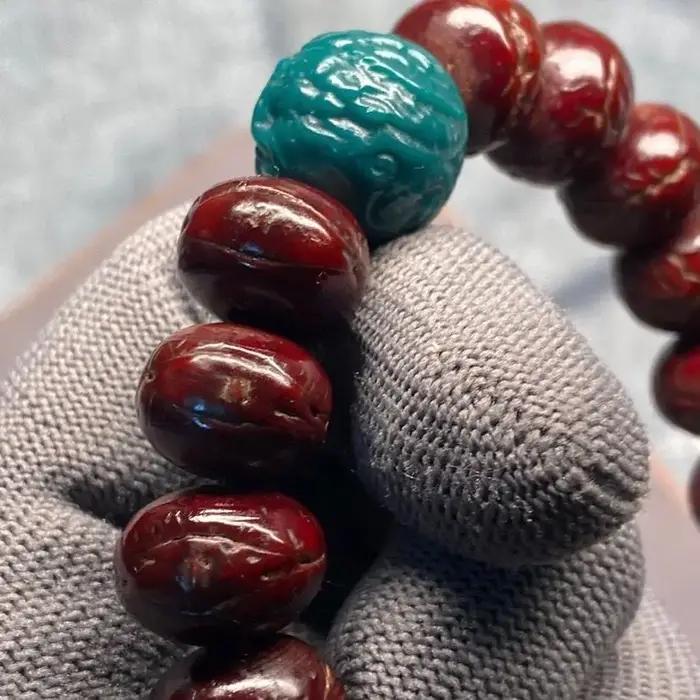 Bracelet tibétain en œil de phénix rouge de 14mm