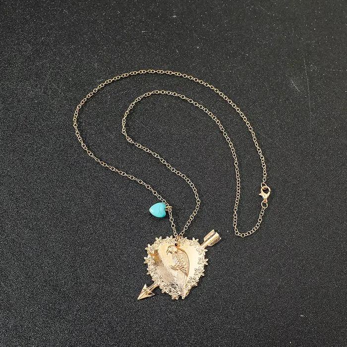 Collier oiseau avec pendentif en forme de cœur pour femme