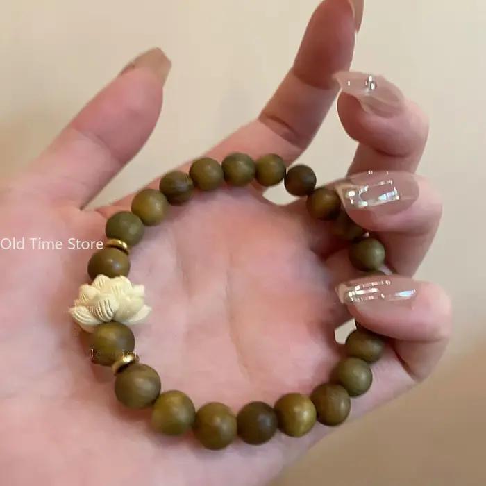 Bracelet de perles en bois réglable avec breloques style mode naturel élégant pour femme et homme en brun rougeâtre ou or jaune