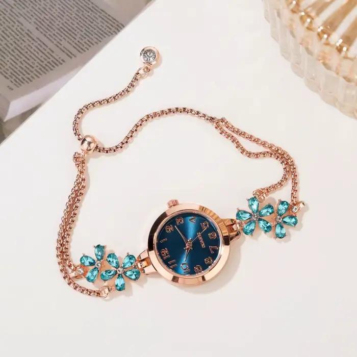 Montre-bracelet femme élégante à quartz avec motif fleurs boîtier métal et boucle bijoux pour style luxe affaires et sport