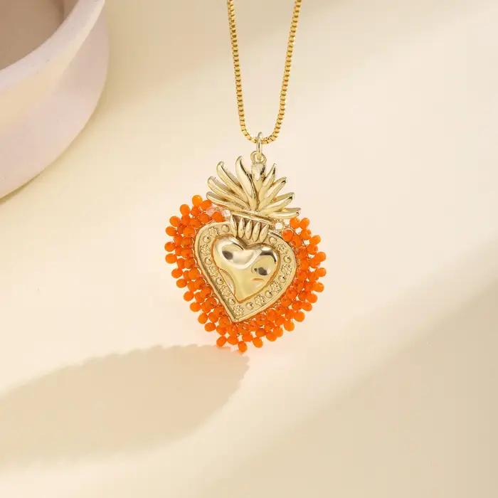 Nidin – collier avec pendentif en forme de cœur sacré