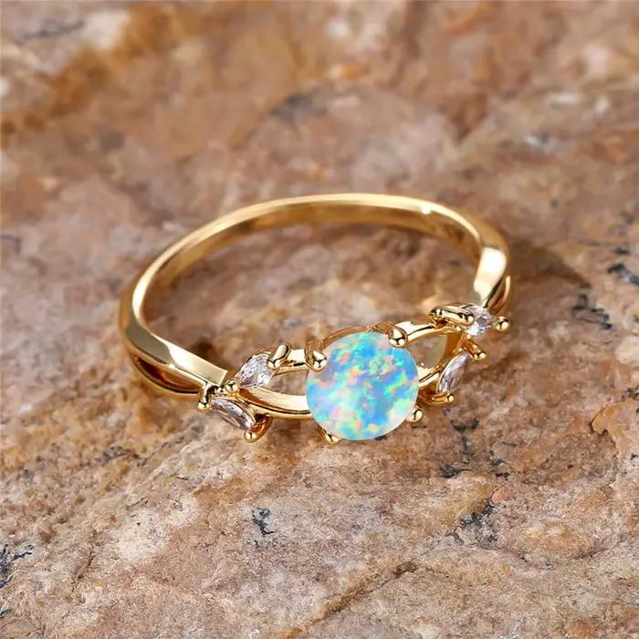 Bague en pierre d'opale de feu ronde blanche pour femme