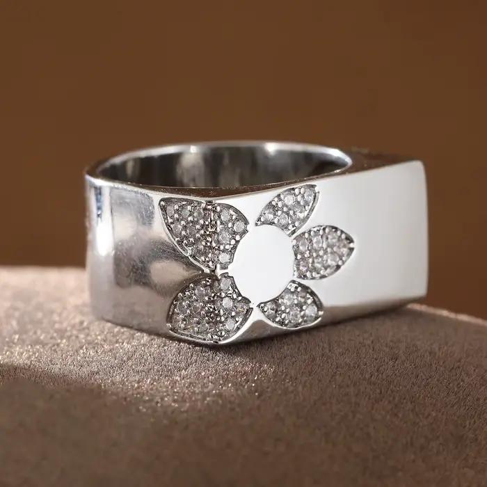 Bague en cuivre de style géométrique moderne avec incrustation florale de pierres précieuses artificielles