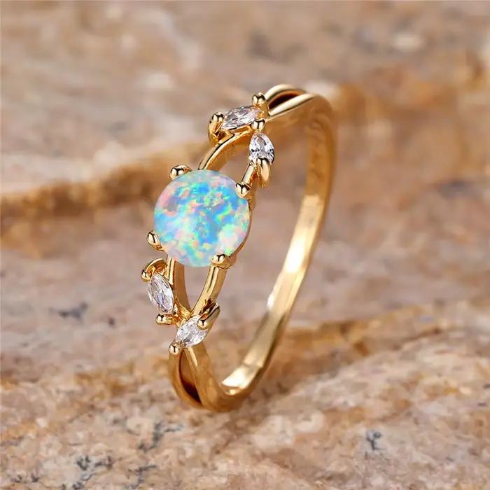 Bague en pierre d'opale de feu ronde blanche pour femme