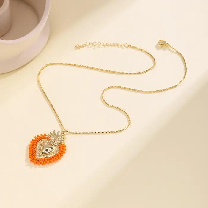 Nidin – collier avec pendentif en forme de cœur sacré