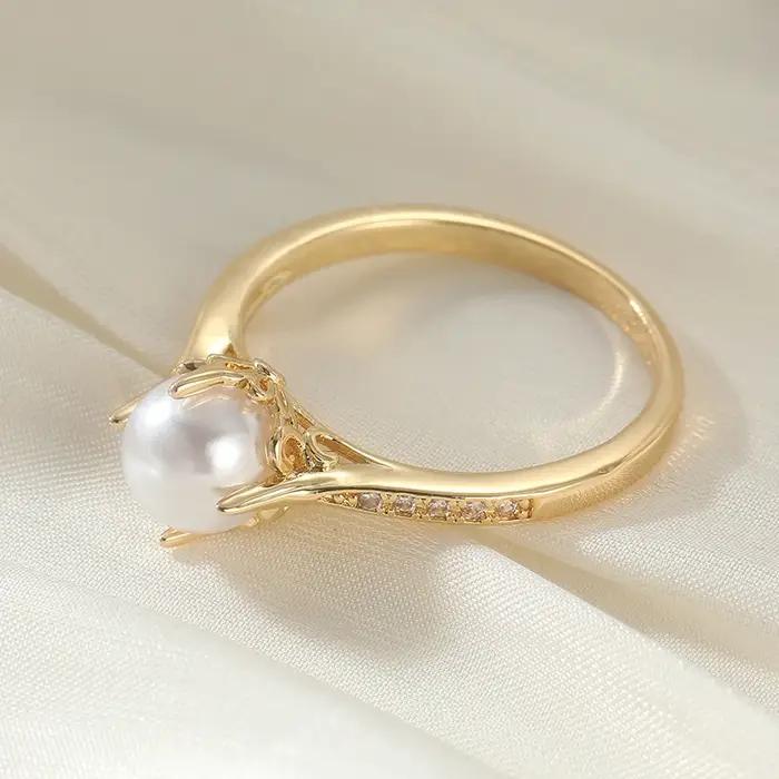 Bague dorée élégante de style bohème avec imitation de perles pour femmes