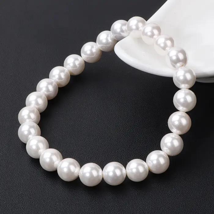 Bracelet élastique en perles de coquillage naturel blanc pour femme