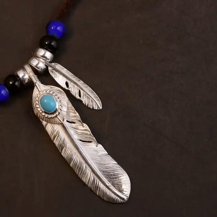 Collier en corde de cuir avec pendentif Turquoise en plumes rétro indiennes