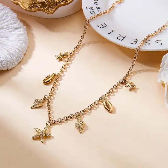 Collier pendentif étoile de mer et coquillage en zircon