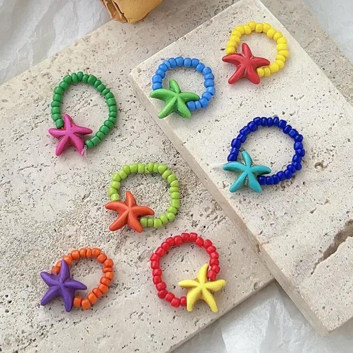 Bague étoile de mer colorée avec perles de rocaille tissées anneau élastique réglable pour filles et enfants bijoux amusants vacances d'été océan fantaisie