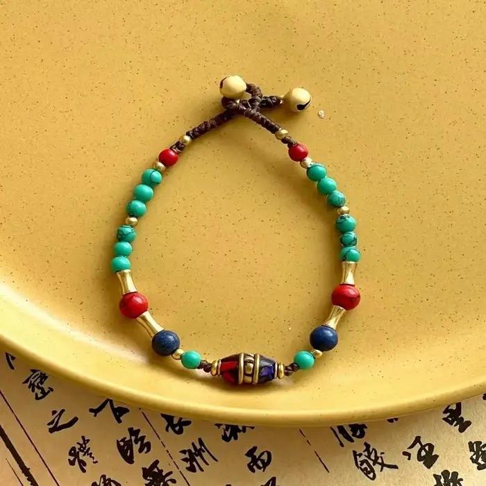 Bracelet tressé tissé à la main de style tibétain ancien, avec clochette exotique du Népal, pour fem