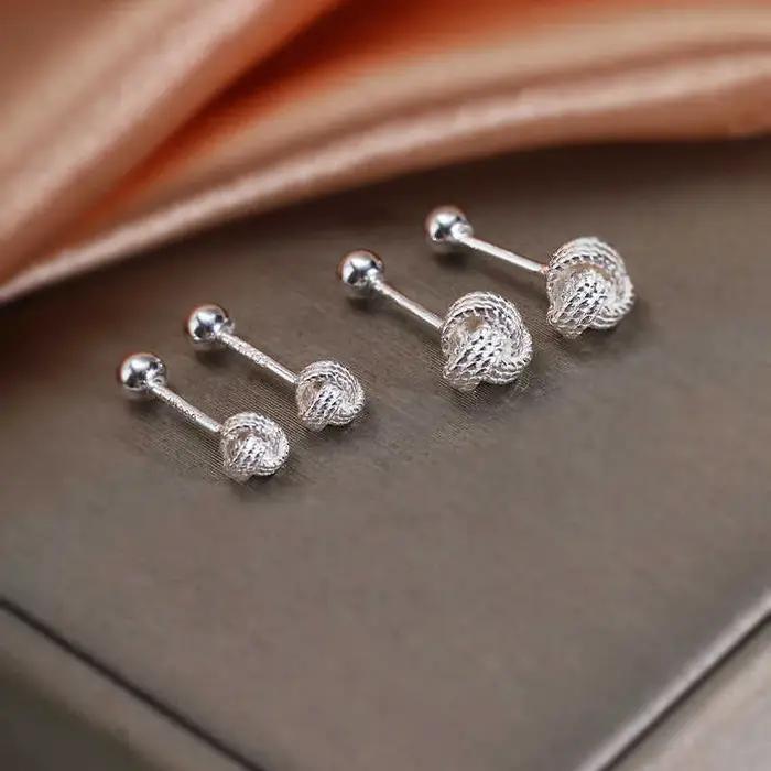 Boucles d'oreilles à vis croisées couleur argent pour femme