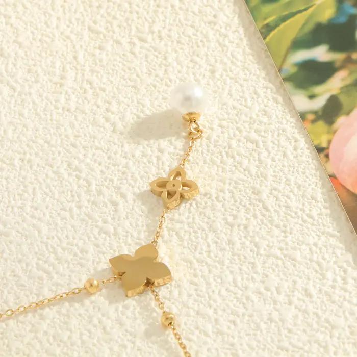 Pendentif trèfle à quatre feuilles en perles avec zircone