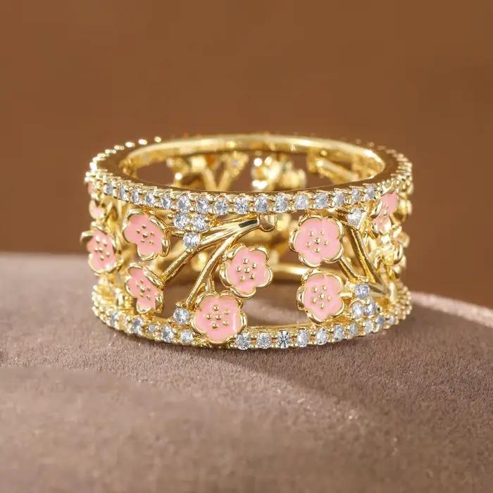 Bague élégante en cuivre de luxe pour femmes, avec fleurs roses et pierres artificielles incrustées, idéale pour les loisirs et les rendez-vous.