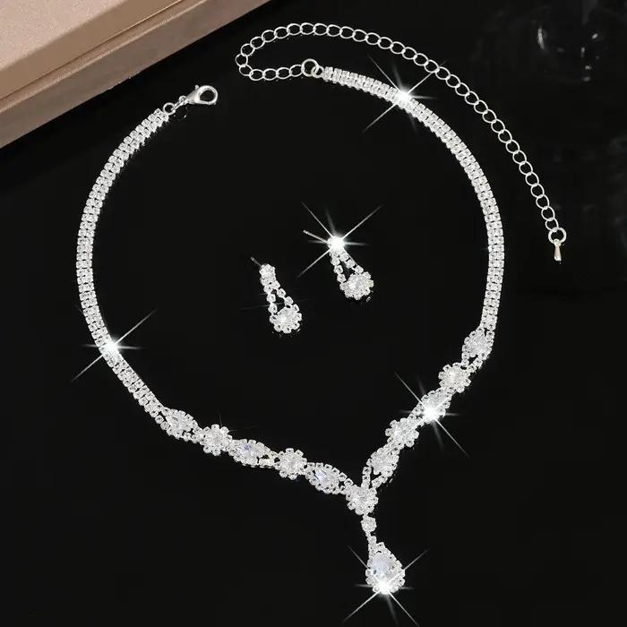 Parure de bijoux de luxe en cristal argenté en forme de goutte pour femme, collier en V et boucles d