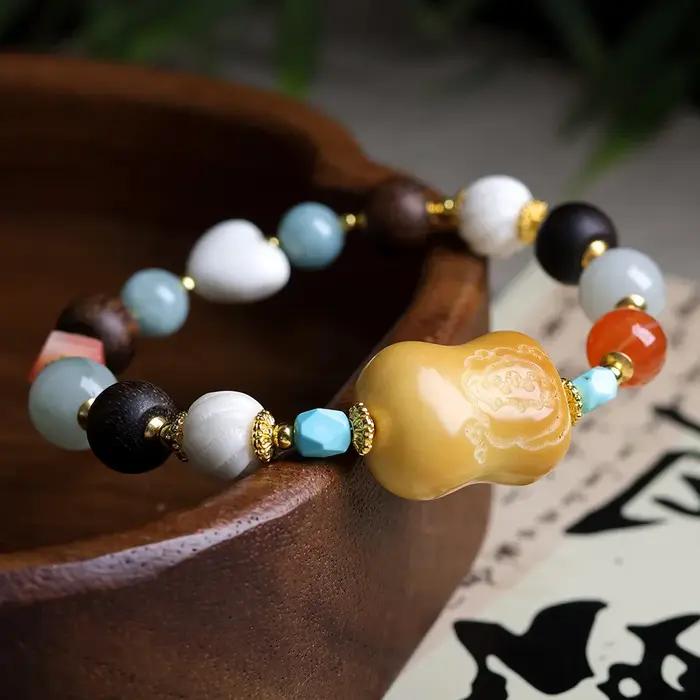 Bracelet en noix de tagua brûlée au charbon avec cœur en corne