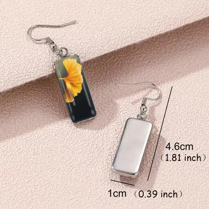 1 paire de boucles d'oreilles à motif de feuilles de Ginkgo de couleur dorée avec verre convexe et crochets longs en