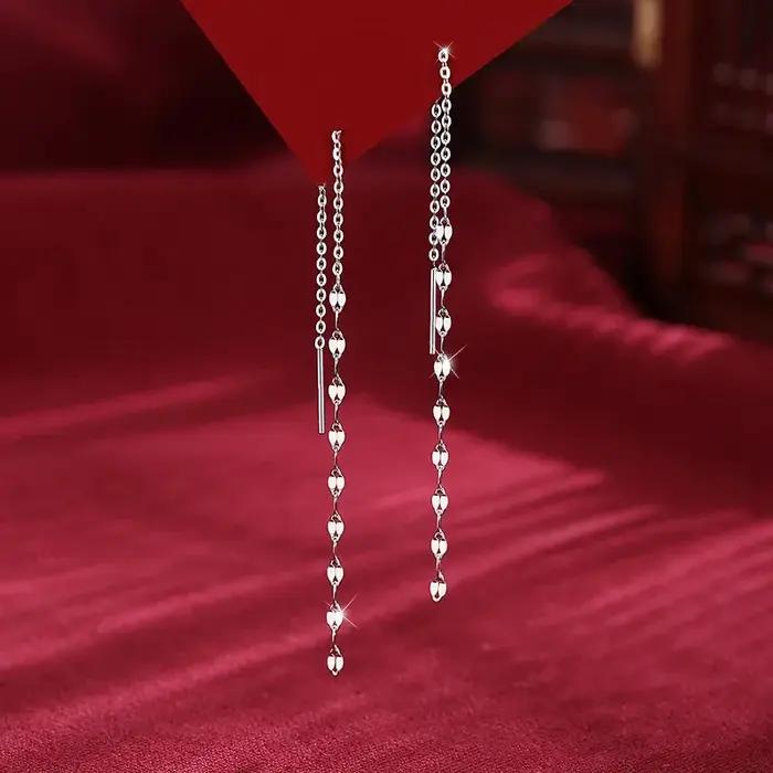 Boucles d'oreilles pendantes torsadées à sequins géométriques couleur argent pour femmes
