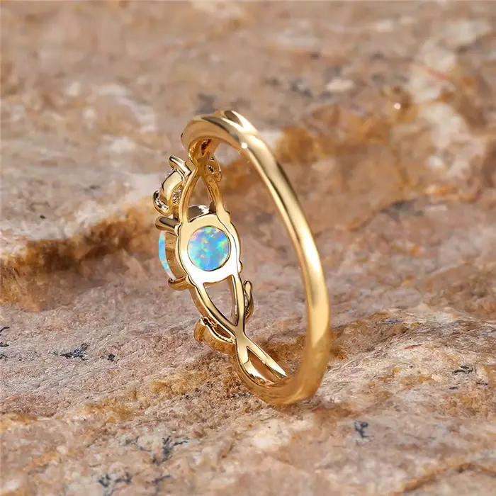 Bague en pierre d'opale de feu ronde blanche pour femme
