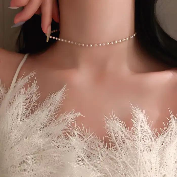 Nouveau Simple Long Imitation perles dos collier pour femmes Sexy gland perle harnais Bikini poitrin