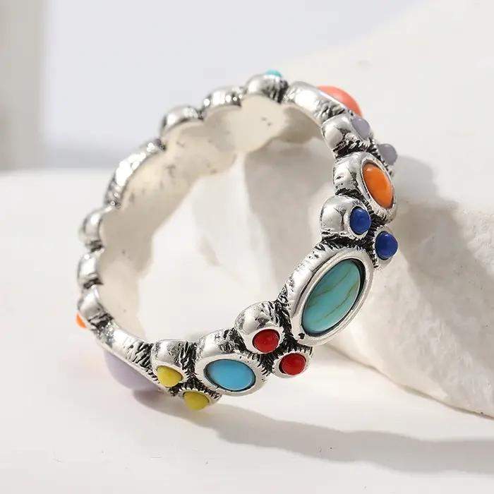 Bague plaquée argent avec pierres synthétiques colorées incrustées