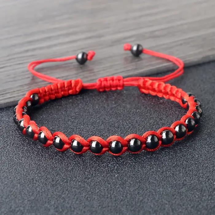 Bracelet Tressé Porte-Bonheur RaeRina en Corde Rouge et Perles en Cuivre Pour Homme et Femme Occasions Spéciales