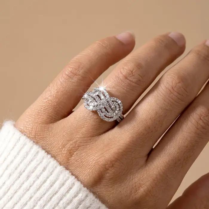 Bague en cuivre avec zircon cubique à nœud croisé pour femme