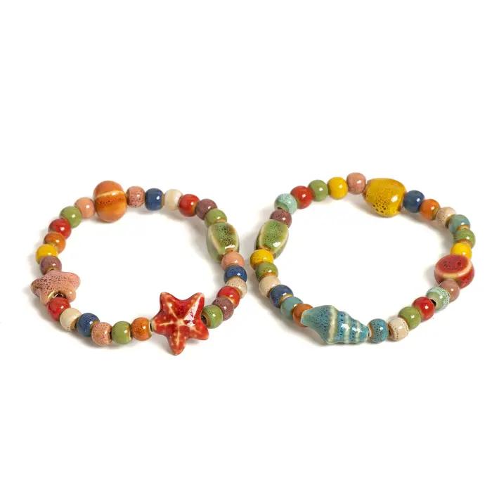 Bracelet de perles en céramique coloré étoile de mer et coquillage fait à la main
