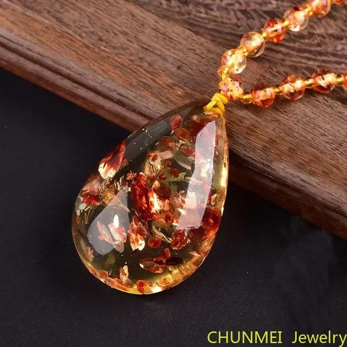 Pendentif goutte de fleur fragmentée pour homme et femme, collier arc-en-ciel original, pierre d'ambre de cire d'abeille, pull
