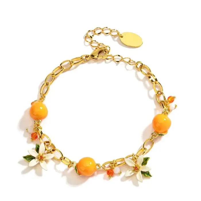 Bracelet en acrylique et cuivre style fleur orange douce pour femme occassions estivales fraicheur douceur naturelle style élégant
