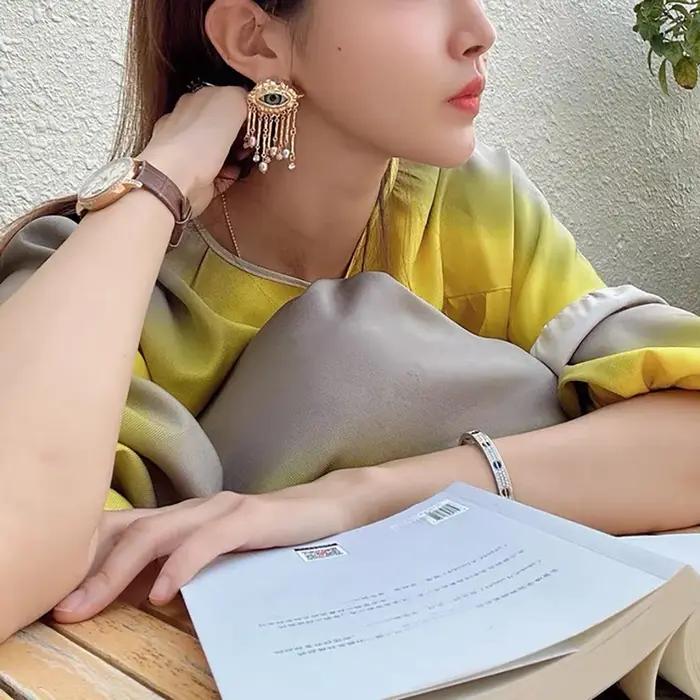 Boucles d'oreilles avec pompon en biscuits perlé pour femmes