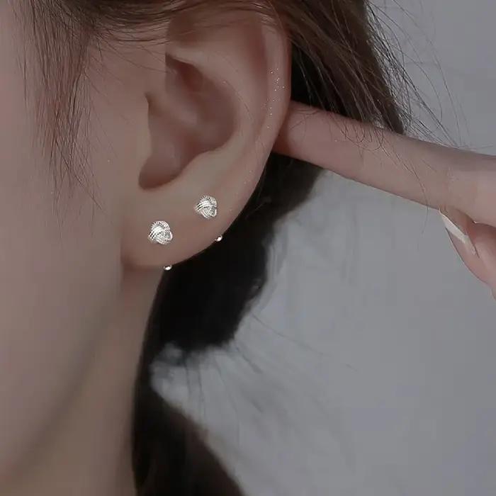Boucles d'oreilles à vis croisées couleur argent pour femme