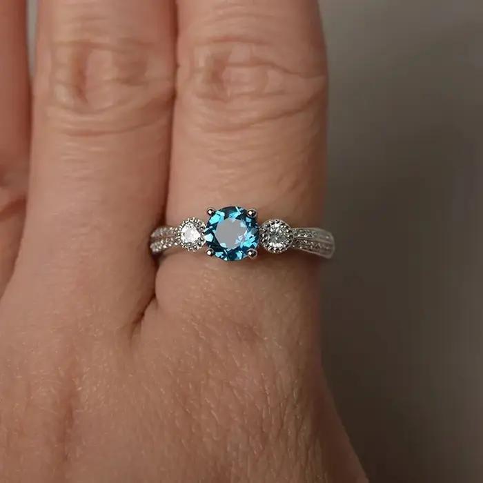 Bague de fiançailles en argent sterling avec topaze bleue pour femme