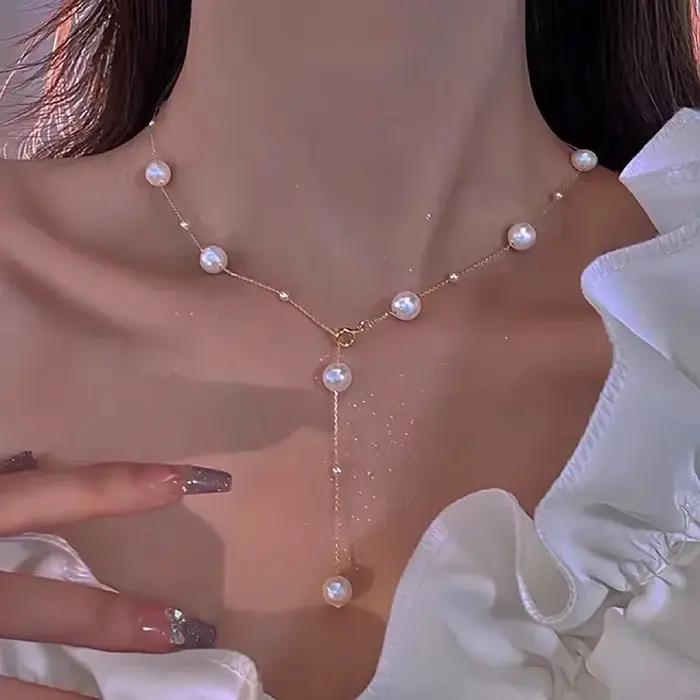 Nouveau Simple Long Imitation perles dos collier pour femmes Sexy gland perle harnais Bikini poitrine chaîne corps bijoux Mujer