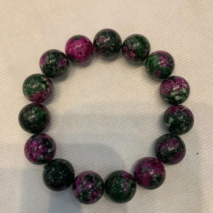 Bracelet de perles rondes en jade de fleur de pêcher colorée
