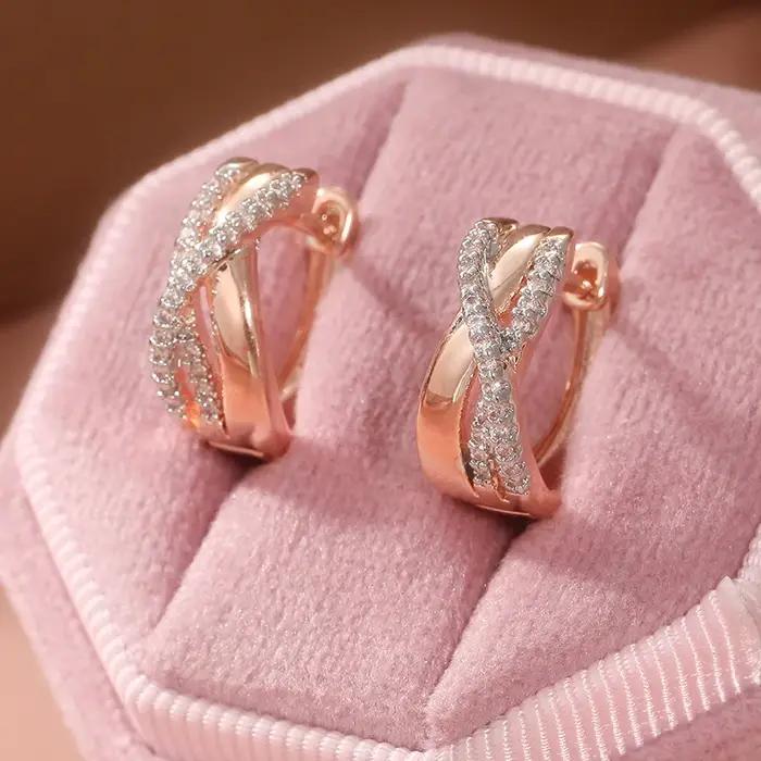 Boucles d'oreilles créoles torsadées en or rose