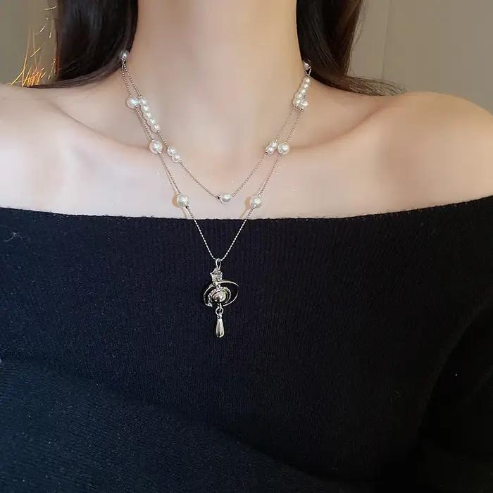 Collier de perles en forme de goutte d'eau saturne incrustée de diamants