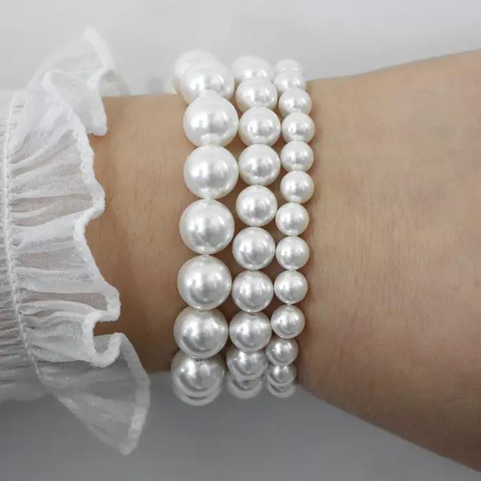 Bracelet élastique en perles de coquillage naturel blanc pour femme